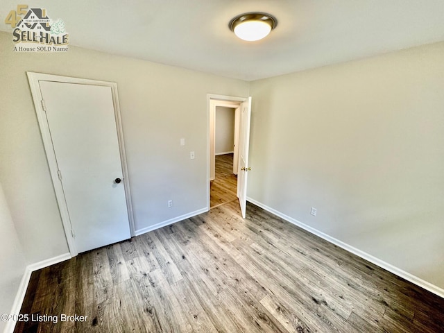 105 Rizer Ave, Springfield, KY 40069 - unfurnished bedroom with wood finished floors and baseboards