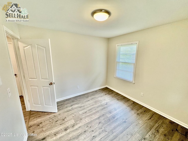105 Rizer Ave, Springfield, KY 40069 - unfurnished room featuring wood finished floors and baseboards