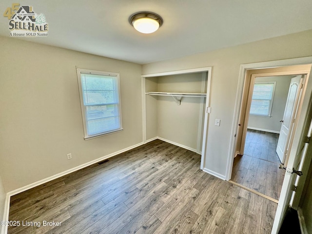 105 Rizer Ave, Springfield, KY 40069 - unfurnished bedroom with wood finished floors, baseboards, and a closet