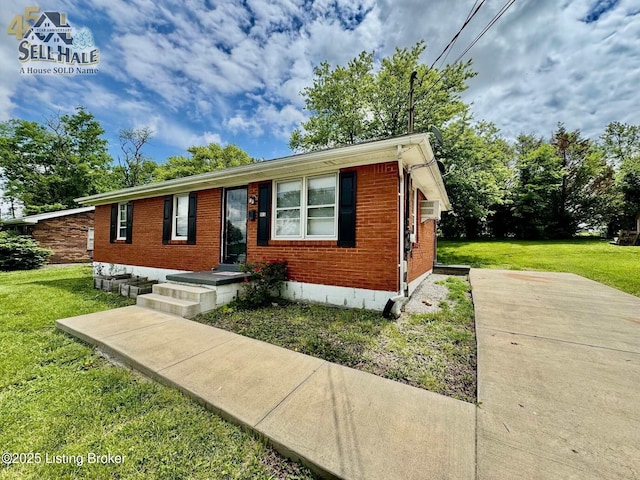 105 Rizer Ave, Springfield, KY 40069 - view of front of house featuring brick siding, a front yard, and cooling unit
