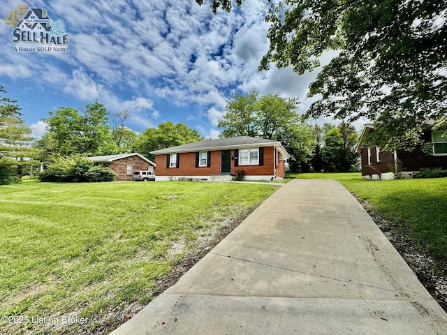 105 Rizer Ave, Springfield, KY 40069 - view of front of home with a front yard, driveway, and brick siding