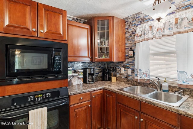 271 Carters St, New Castle, KY 40050 - kitchen with black appliances, a sink, brown cabinetry, glass insert cabinets, and a textured ceiling
