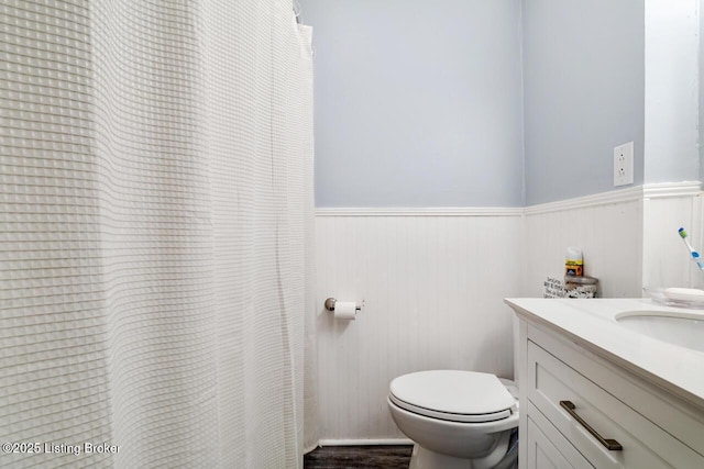 271 Carters St, New Castle, KY 40050 - bathroom with wainscoting, toilet, vanity, and wood finished floors