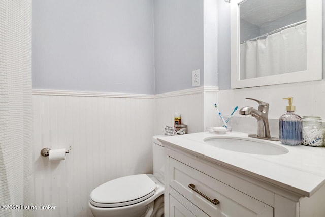 271 Carters St, New Castle, KY 40050 - bathroom with toilet, a wainscoted wall, and vanity