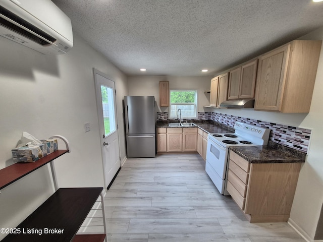 119 Melton Ave, Elizabethtown, KY 42701 - kitchen featuring electric range, freestanding refrigerator, an AC wall unit, a sink, and under cabinet range hood