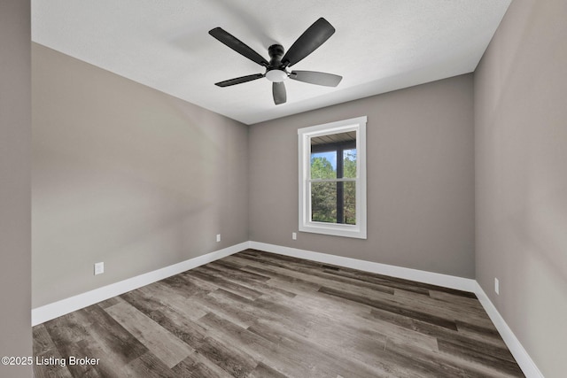 314 Nolin Estates Rd, Clarkson, KY 42726 - unfurnished room with baseboards, wood finished floors, and ceiling fan