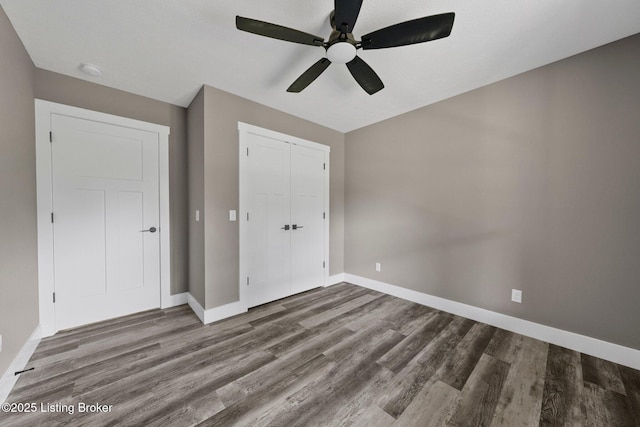 314 Nolin Estates Rd, Clarkson, KY 42726 - unfurnished bedroom with wood finished floors, baseboards, a closet, and ceiling fan