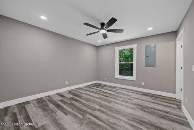 314 Nolin Estates Rd, Clarkson, KY 42726 - unfurnished room featuring electric panel, a ceiling fan, wood finished floors, baseboards, and recessed lighting