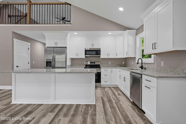 314 Nolin Estates Rd, Clarkson, KY 42726 - kitchen featuring appliances with stainless steel finishes, a sink, a center island, white cabinetry, and recessed lighting