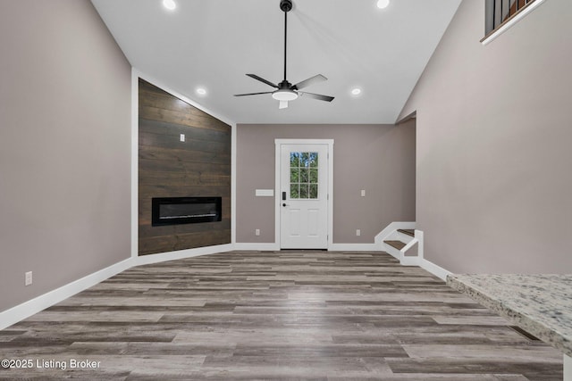 314 Nolin Estates Rd, Clarkson, KY 42726 - unfurnished living room featuring lofted ceiling, a ceiling fan, a fireplace, recessed lighting, and wood finished floors