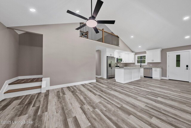 314 Nolin Estates Rd, Clarkson, KY 42726 - unfurnished living room with high vaulted ceiling, light wood-style floors, baseboards, a ceiling fan, and recessed lighting