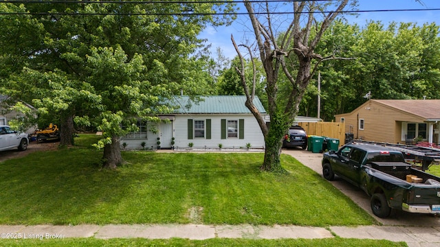 single story home with metal roof