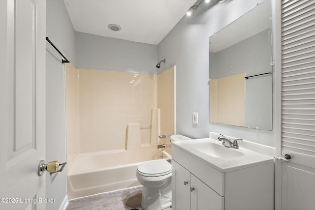 6614 Putman St, Louisville, KY 40216 - bathroom featuring vanity, toilet, tub / shower combination, and wood finished floors