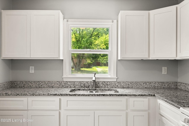1037 Kaiser Ct, Louisville, KY 40211 - kitchen featuring a sink and white cabinetry