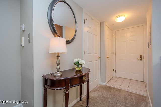 2730 Brownsboro Rd Apt 166, Louisville, KY 40206 - foyer featuring light carpet, baseboards, and light tile patterned floors