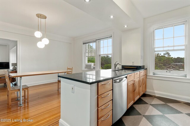 1412 Willow Ave Unit 69, Louisville, KY 40204 - kitchen featuring stainless steel dishwasher, a sink, baseboards, a peninsula, and tile patterned floors