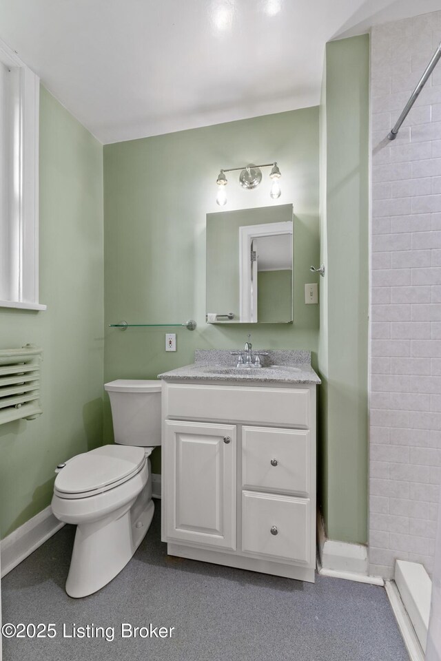 1412 Willow Ave Unit 69, Louisville, KY 40204 - bathroom featuring toilet, a shower, vanity, and baseboards