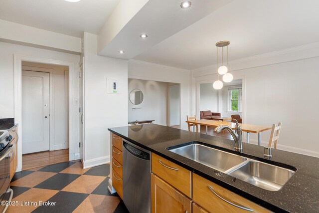 1412 Willow Ave Unit 69, Louisville, KY 40204 - kitchen featuring appliances with stainless steel finishes, dark floors, a sink, dark stone countertops, and decorative light fixtures
