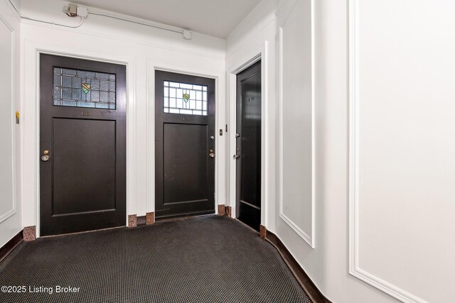 1412 Willow Ave Unit 69, Louisville, KY 40204 - foyer entrance featuring dark colored carpet