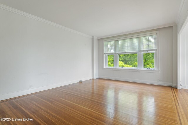 1412 Willow Ave Unit 69, Louisville, KY 40204 - spare room featuring wood finished floors, ornamental molding, and baseboards