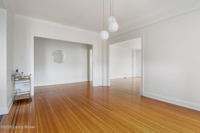 1412 Willow Ave Unit 69, Louisville, KY 40204 - empty room featuring ornamental molding, baseboards, and wood finished floors