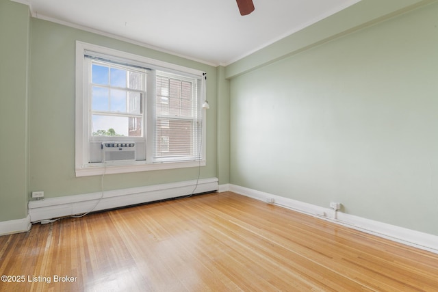 1412 Willow Ave Unit 69, Louisville, KY 40204 - spare room with a baseboard radiator, crown molding, wood finished floors, baseboards, and a ceiling fan