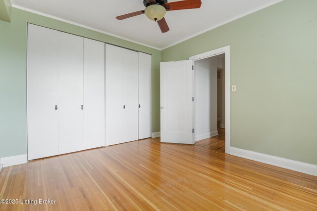 1412 Willow Ave Unit 69, Louisville, KY 40204 - unfurnished bedroom with a closet, baseboards, crown molding, light wood-type flooring, and a ceiling fan