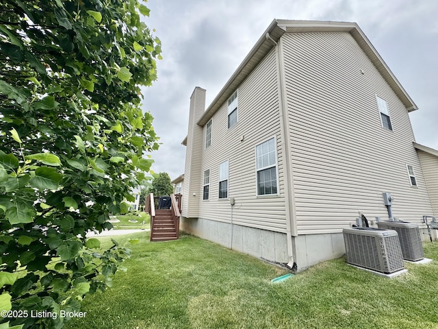 10923 Collington Dr, Louisville, KY 40241 - view of side of property featuring central air condition unit and a lawn