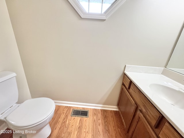 10923 Collington Dr, Louisville, KY 40241 - bathroom featuring wood finished floors, baseboards, toilet, vanity, and a skylight