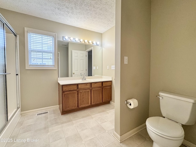 10923 Collington Dr, Louisville, KY 40241 - bathroom featuring toilet, vanity, a shower with shower door, a textured ceiling, and baseboards