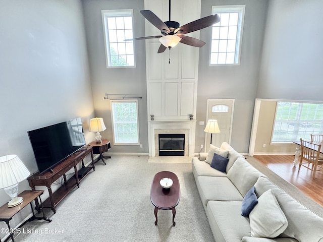 10923 Collington Dr, Louisville, KY 40241 - living room with a high ceiling, a ceiling fan, plenty of natural light, a fireplace, and baseboards
