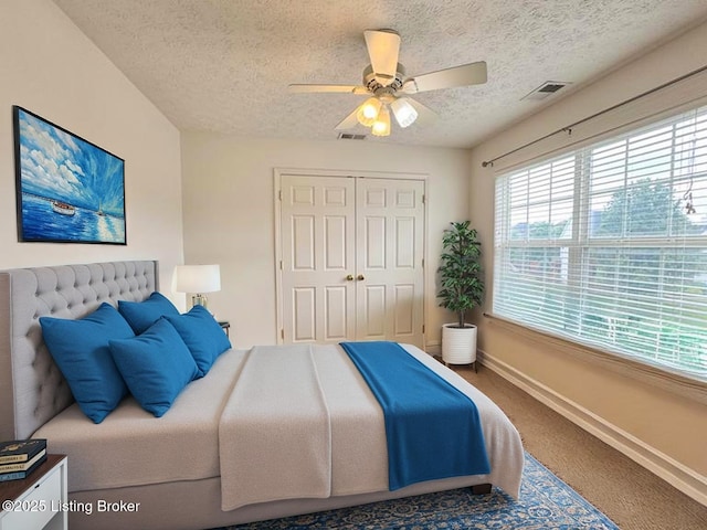 10923 Collington Dr, Louisville, KY 40241 - bedroom featuring baseboards, a textured ceiling, carpet, a closet, and a ceiling fan