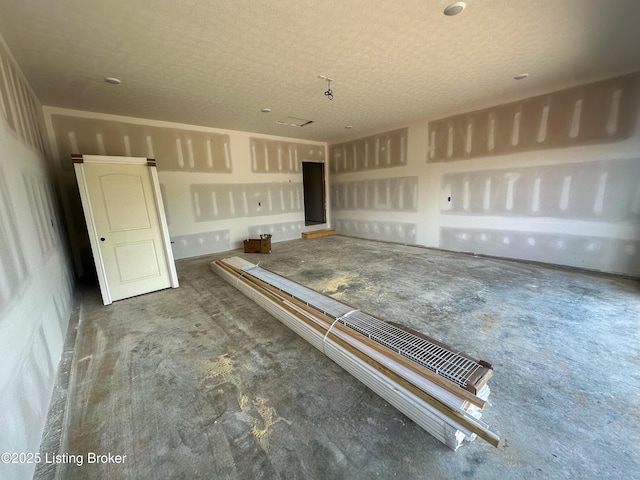 165 Gordon Dr, Ekron, KY 40117 - interior space with a textured ceiling and concrete flooring