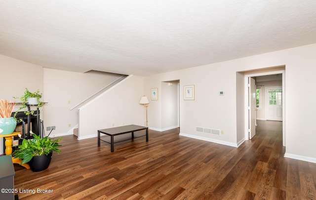 10600 Colonial Woods Way Unit 9-1, Louisville, KY 40223 - living area featuring wood finished floors, stairs, baseboards, and a textured ceiling