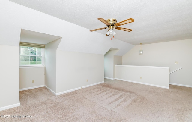 10600 Colonial Woods Way Unit 9-1, Louisville, KY 40223 - additional living space featuring ceiling fan, carpet, vaulted ceiling, baseboards, and a textured ceiling