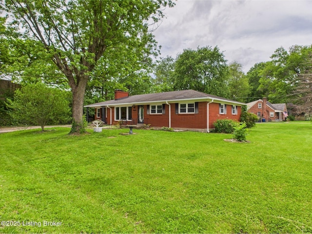 4212 David Ave, Louisville, KY 40215 - view of front of home featuring a chimney, a front yard, and brick siding
