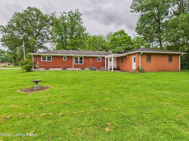 4212 David Ave, Louisville, KY 40215 - rear view of property featuring a yard, a patio area, and brick siding