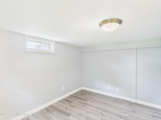 4212 David Ave, Louisville, KY 40215 - below grade area featuring light wood finished floors and baseboards