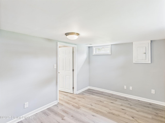 4212 David Ave, Louisville, KY 40215 - basement featuring light wood-style floors, electric panel, and baseboards