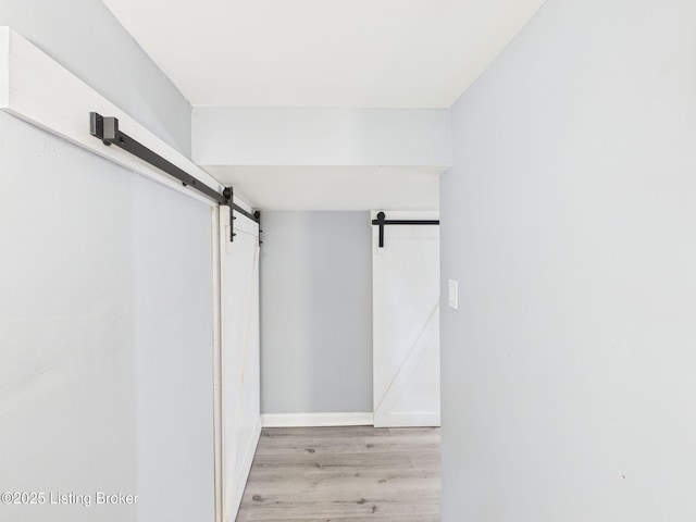 4212 David Ave, Louisville, KY 40215 - walk in closet with a barn door and wood finished floors