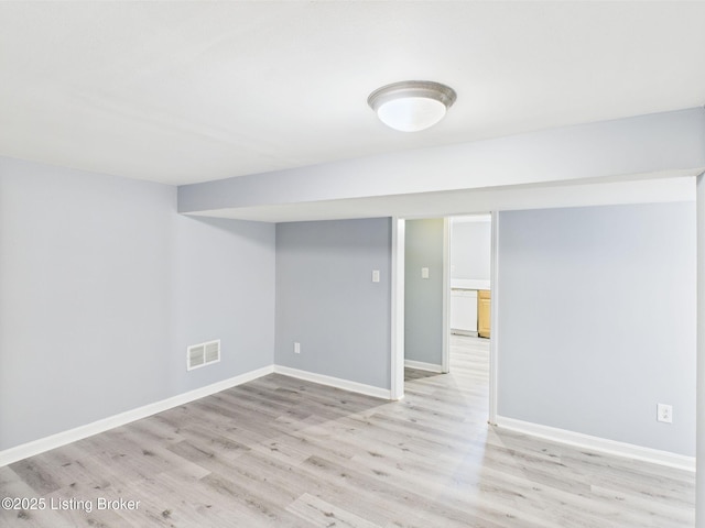 4212 David Ave, Louisville, KY 40215 - finished basement with light wood-style floors and baseboards