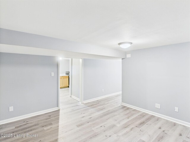 4212 David Ave, Louisville, KY 40215 - finished basement with light wood-style floors and baseboards