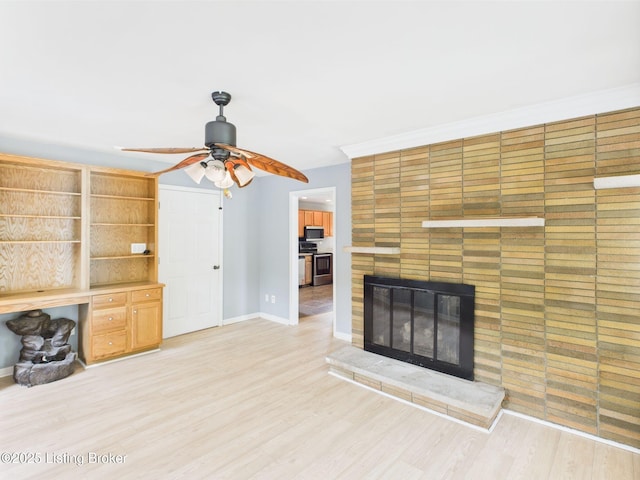 4212 David Ave, Louisville, KY 40215 - unfurnished living room with ceiling fan, light wood finished floors, baseboards, and a fireplace