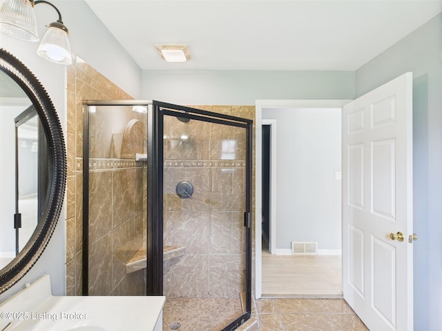4212 David Ave, Louisville, KY 40215 - full bathroom with a stall shower, marble look tiles, and vanity