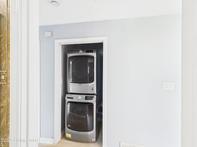 4212 David Ave, Louisville, KY 40215 - clothes washing area with stacked washer and clothes dryer and baseboards