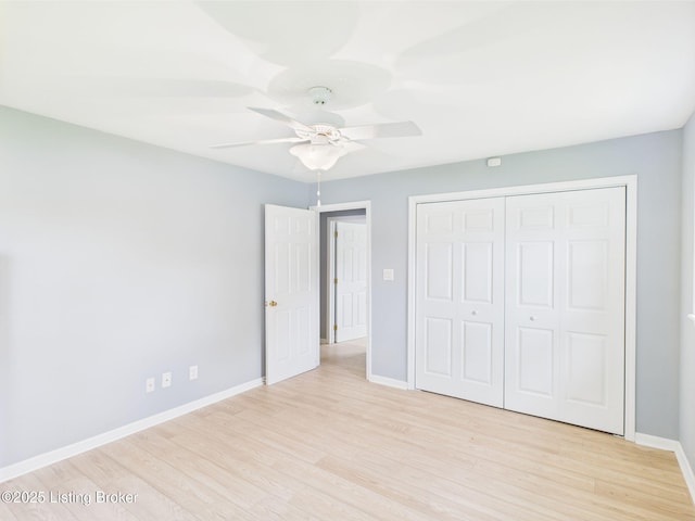 4212 David Ave, Louisville, KY 40215 - unfurnished bedroom featuring light wood-type flooring, baseboards, a closet, and a ceiling fan