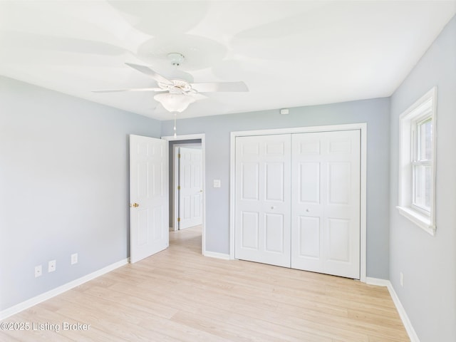 4212 David Ave, Louisville, KY 40215 - unfurnished bedroom featuring light wood finished floors, baseboards, a closet, and ceiling fan
