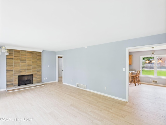 4212 David Ave, Louisville, KY 40215 - unfurnished living room with light wood-type flooring, a fireplace, and baseboards