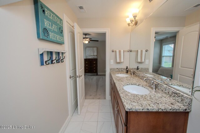 18705 Weymuth Ln, Louisville, KY 40245 - ensuite bathroom with marble finish flooring, double vanity, ceiling fan, and baseboards