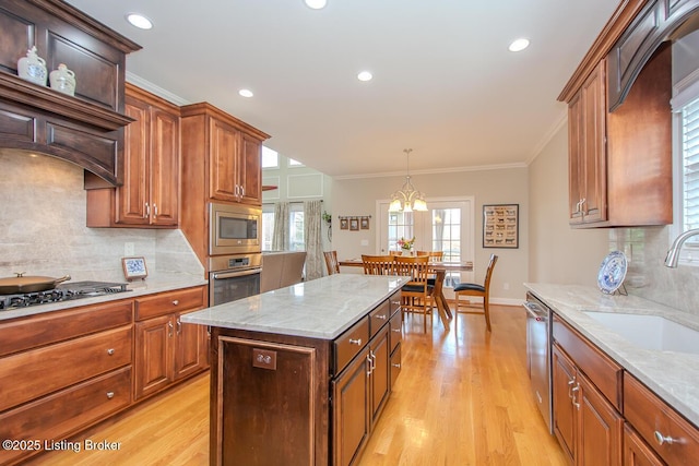 18705 Weymuth Ln, Louisville, KY 40245 - kitchen with stainless steel appliances, a sink, light wood finished floors, decorative backsplash, and ornamental molding